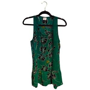 Cabi Tank Top. Green with black and lime colored floral pattern. Peplum bottom.